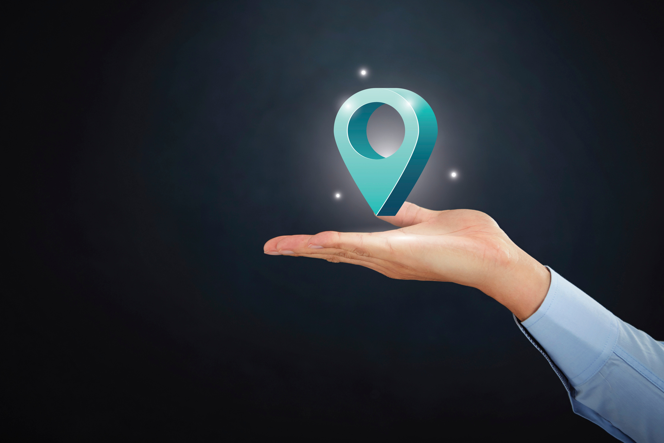 Hand presenting location sign